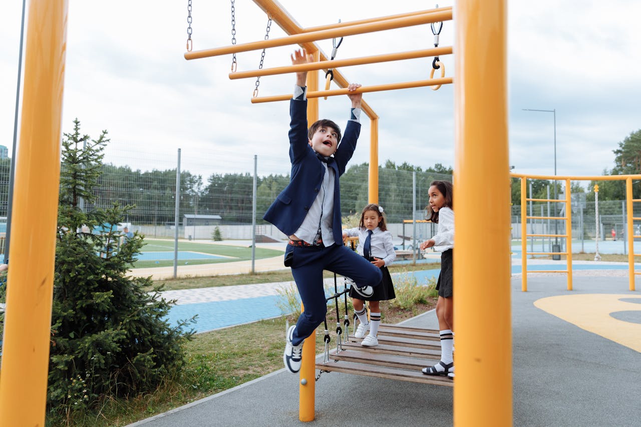 kid climbs on playground 